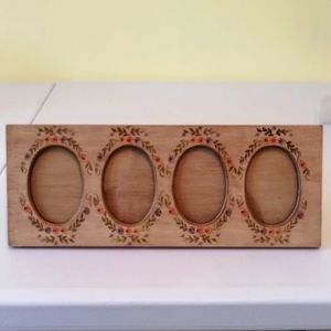 Vintage hand painted wooden picture frame with 4 oval openings.